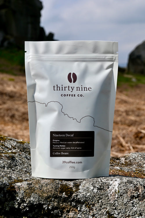 A bag of Thirty Nine coffee Nineteen Blend beans in front of the cow and calf rocks in Ilkley