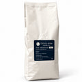 The Nightcap 1kg Decaf Coffee Beans — cream coffee bag on white with a soft shadow