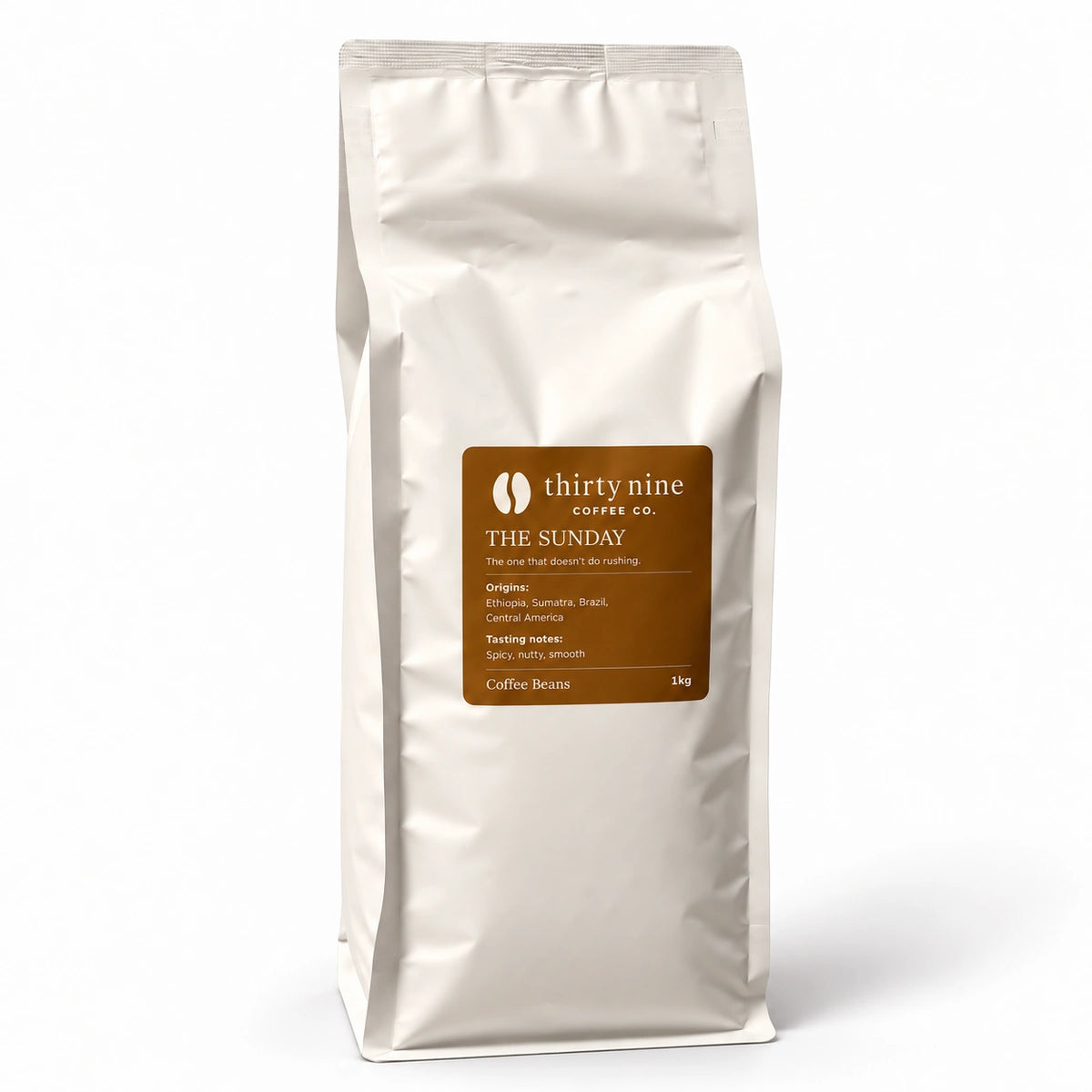 The Sunday 1kg Smooth Coffee Beans — cream coffee bag on white with a soft shadow